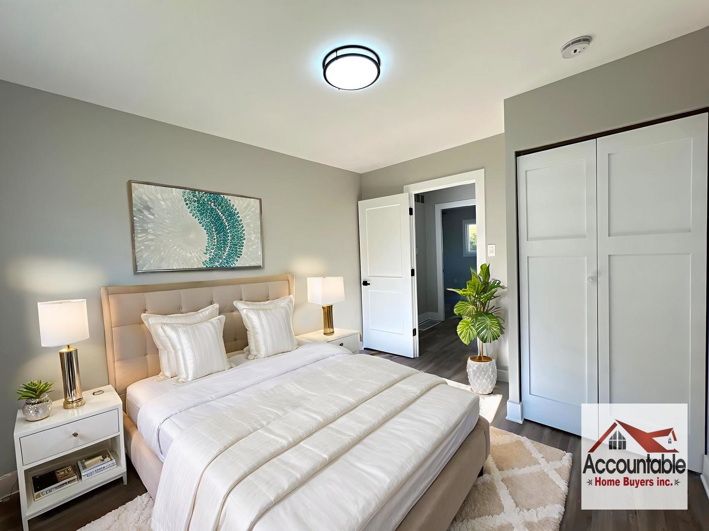 290 Merrill Avenue Calumet City, IL 60409 - Photo 12 of 18 a bedroom with a bed and a painting on the wall