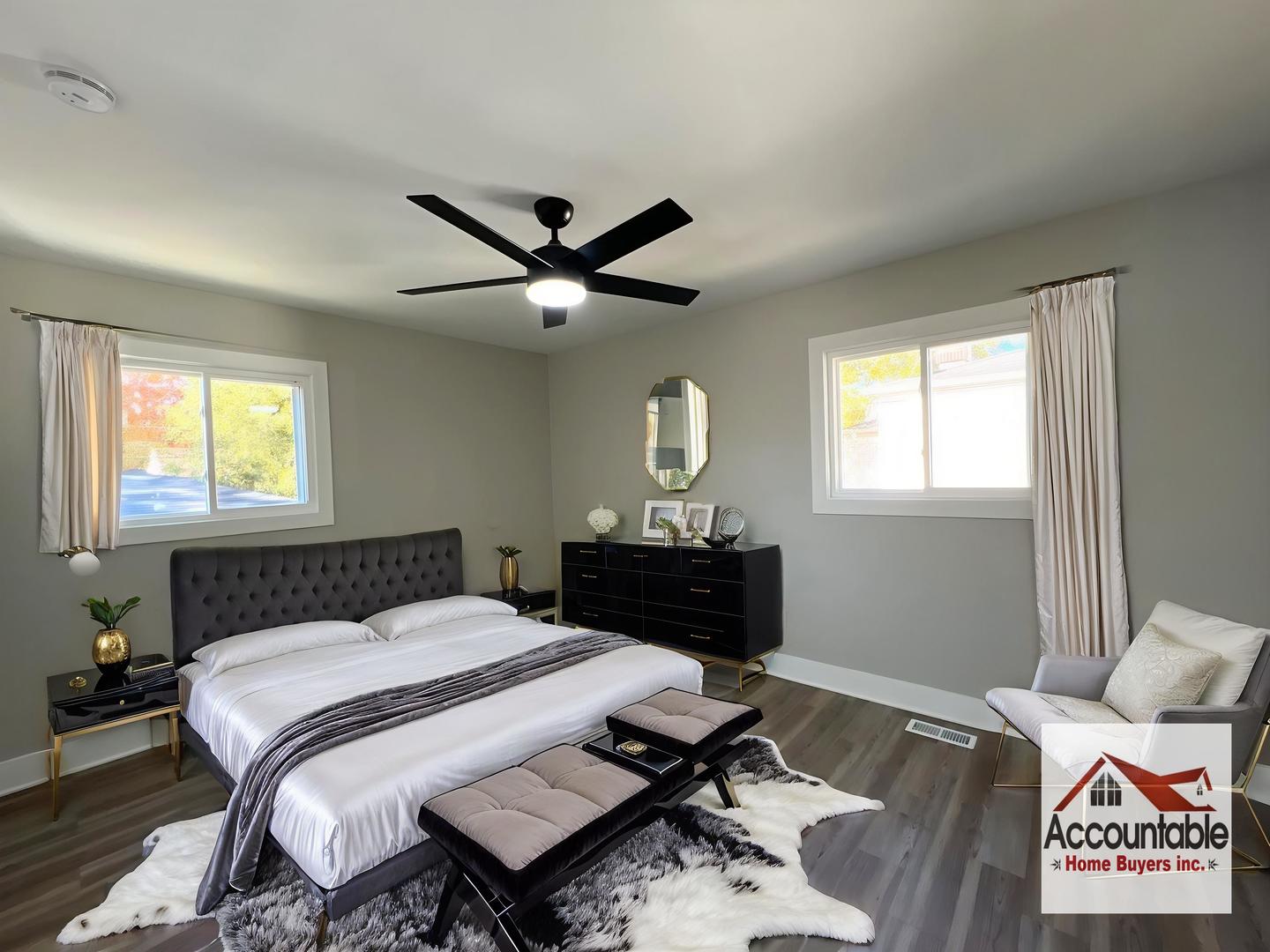 290 Merrill Avenue Calumet City, IL 60409 - Photo 10 of 18 a bedroom with a bed and a table in it