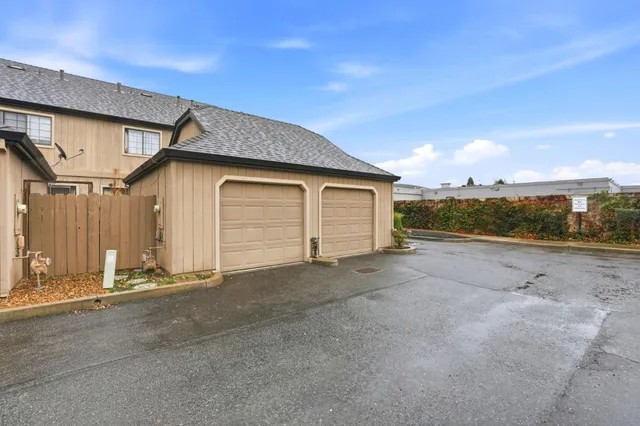 a view of a street with chairs