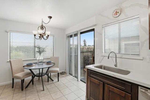 a kitchen with a stove sink and cabinets
