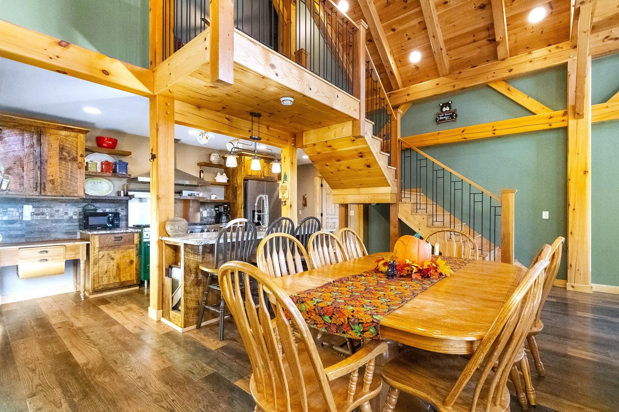 6014 Brown Road Kettle River, MN 55757 - Photo 12 of 54 Dining space featuring stairway, dark wood-style flooring, and recessed lighting
