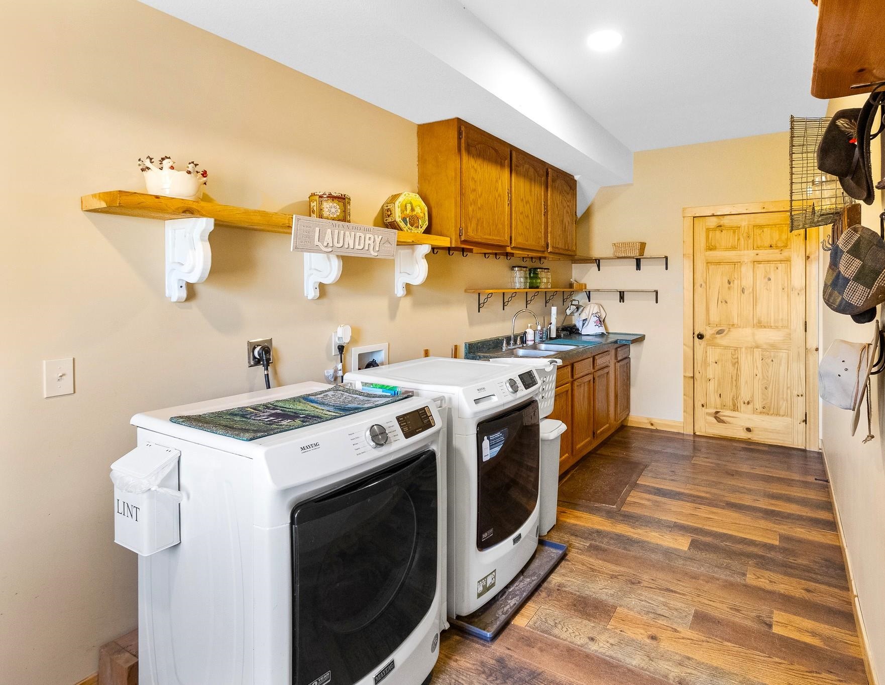 6014 Brown Road Kettle River, MN 55757 - Photo 25 of 54 Laundry room featuring dark wood-style flooring and washing machine and dryer