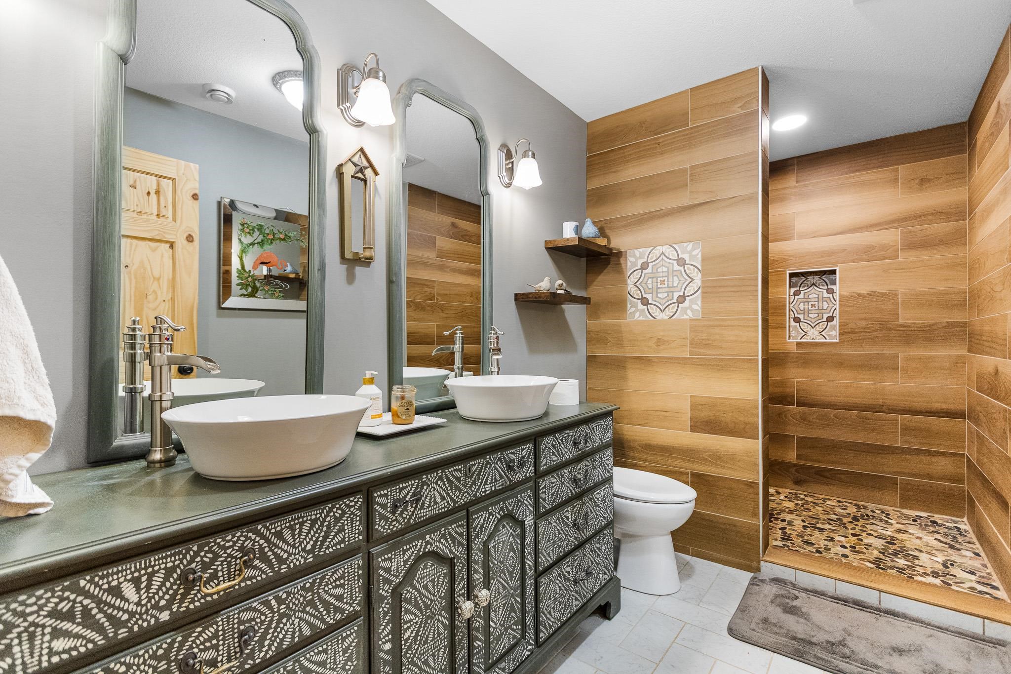 6014 Brown Road Kettle River, MN 55757 - Photo 26 of 54 Full bathroom featuring double vanity, a walk in shower, and light tile patterned floors