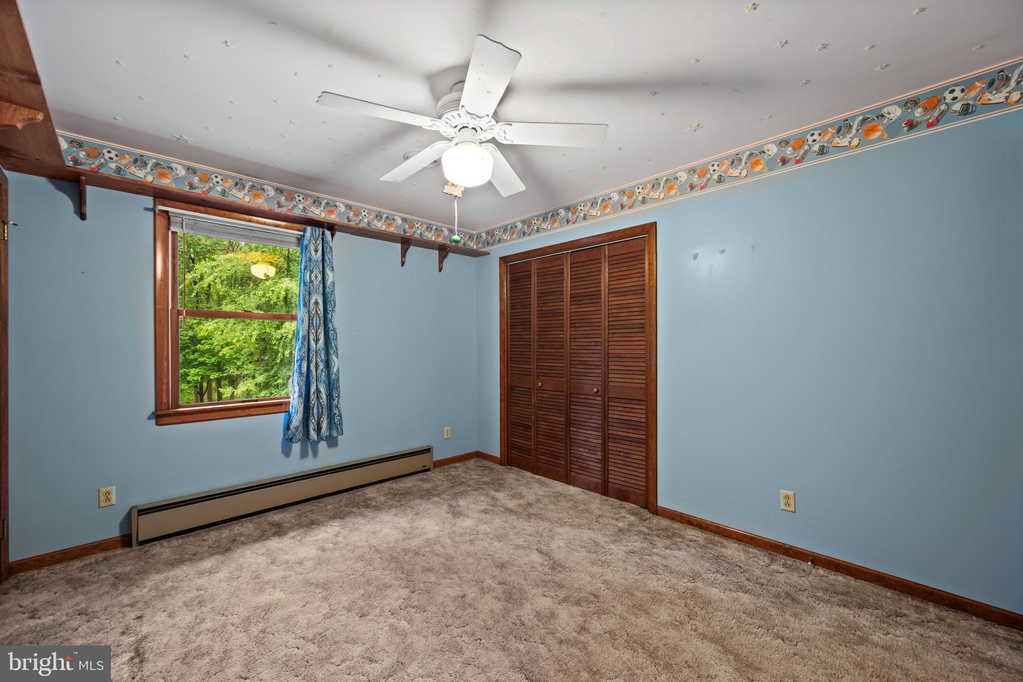 5313 Wentz Road Manchester, MD 21102 - Photo 13 of 51 a view of an empty room with wooden floor and fan