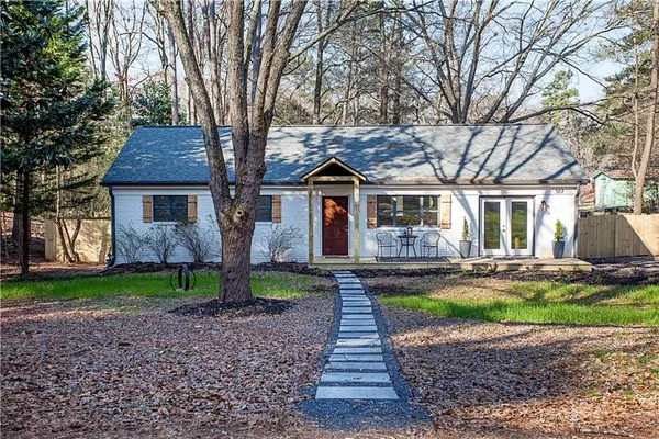 a front view of a house with garden