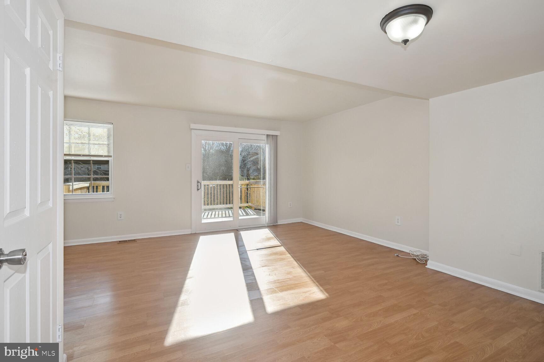 8324 Mountain Ash Way Gaithersburg, MD 20879 - Photo 6 of 36 Spacious Living Room with access to deck