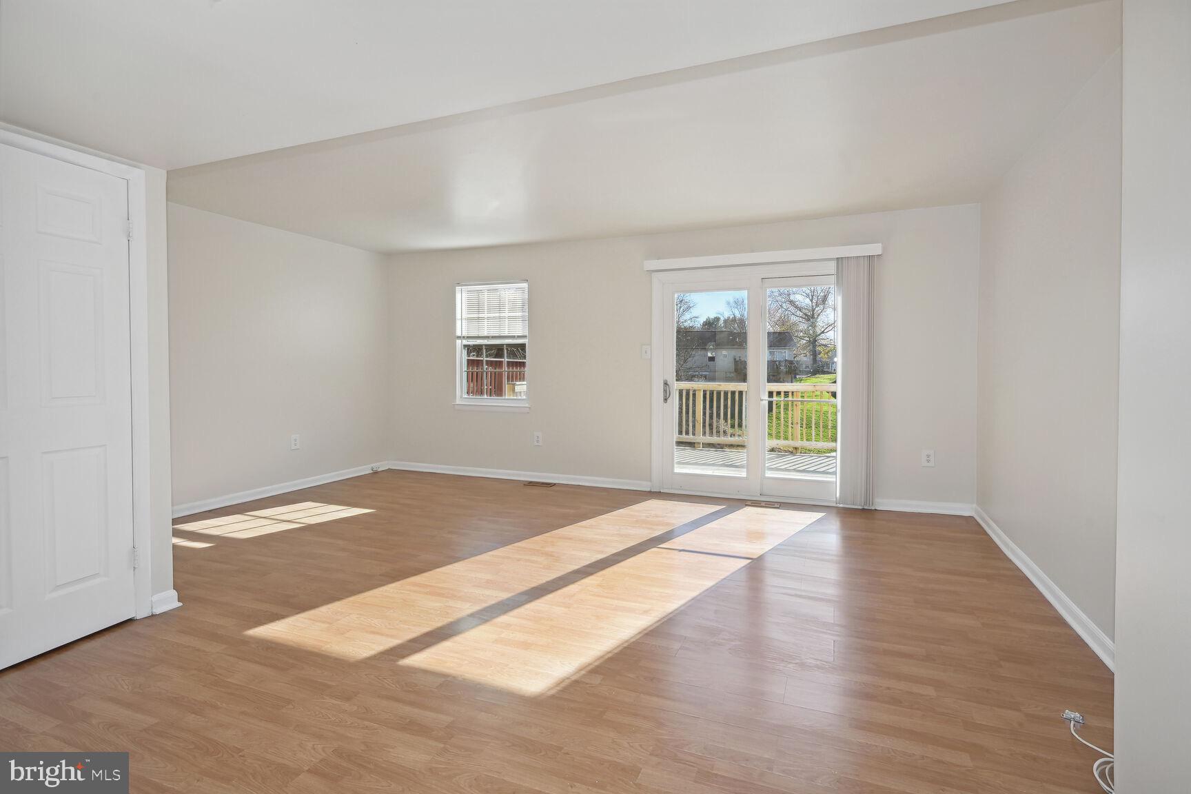 8324 Mountain Ash Way Gaithersburg, MD 20879 - Photo 7 of 36 Spacious Living Room with access to deck