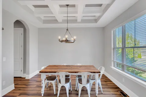 a kitchen with granite countertop a sink a counter top space stainless steel appliances and cabinets