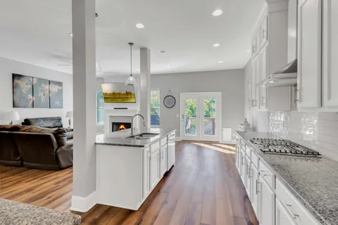 a white toilet sitting next to a bathroom sink