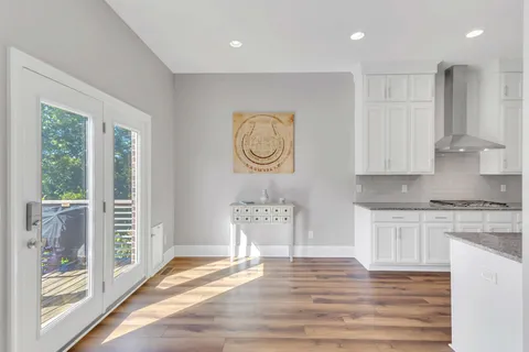 a living room with furniture fireplace and window