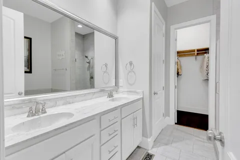 a living room with furniture and a ceiling fan