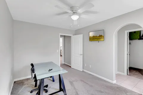 a view of a house with backyard and sitting area