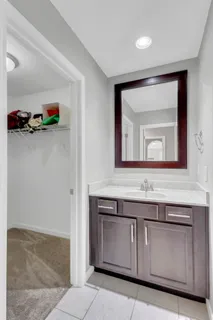 an aerial view of a swimming pool with outdoor seating