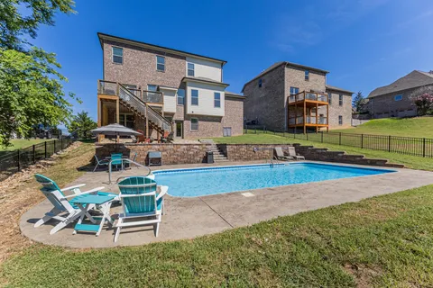 a view of a livingroom with wooden floor and a window