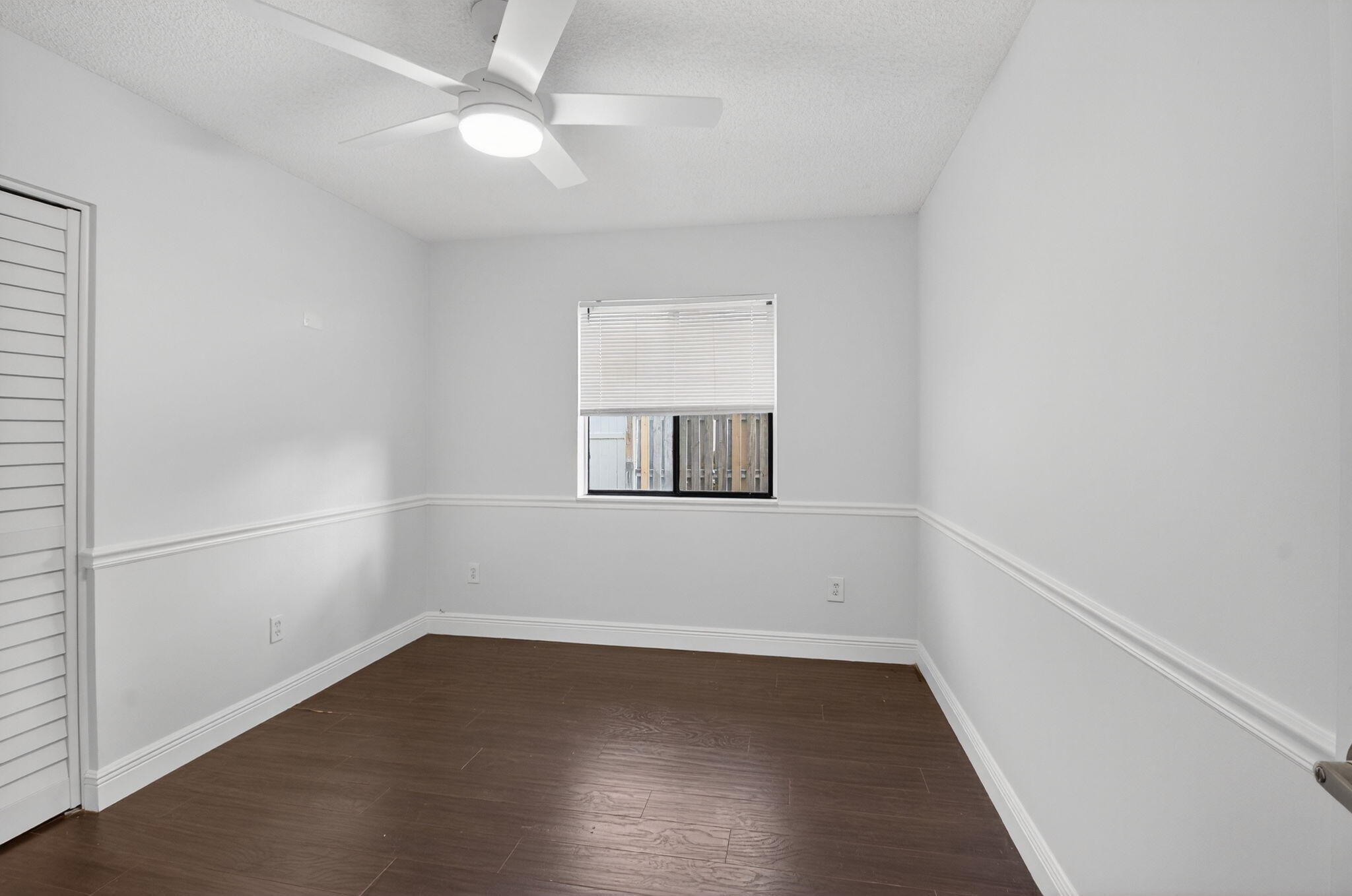 4135 Bay Laurel Way Boca Raton, FL 33487 - Photo 21 of 52 an empty room with a window and ceiling fan