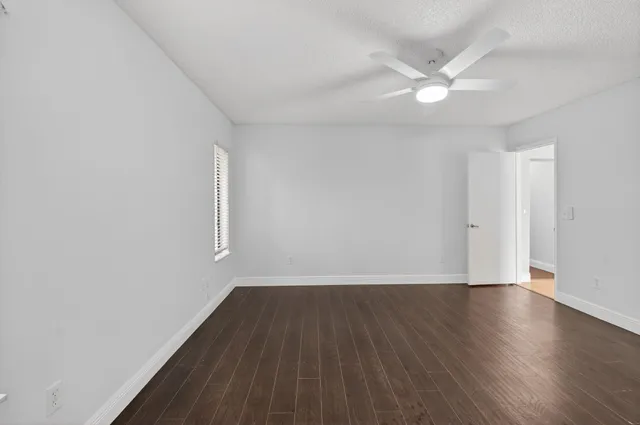 a view of a swimming pool with a patio and a yard