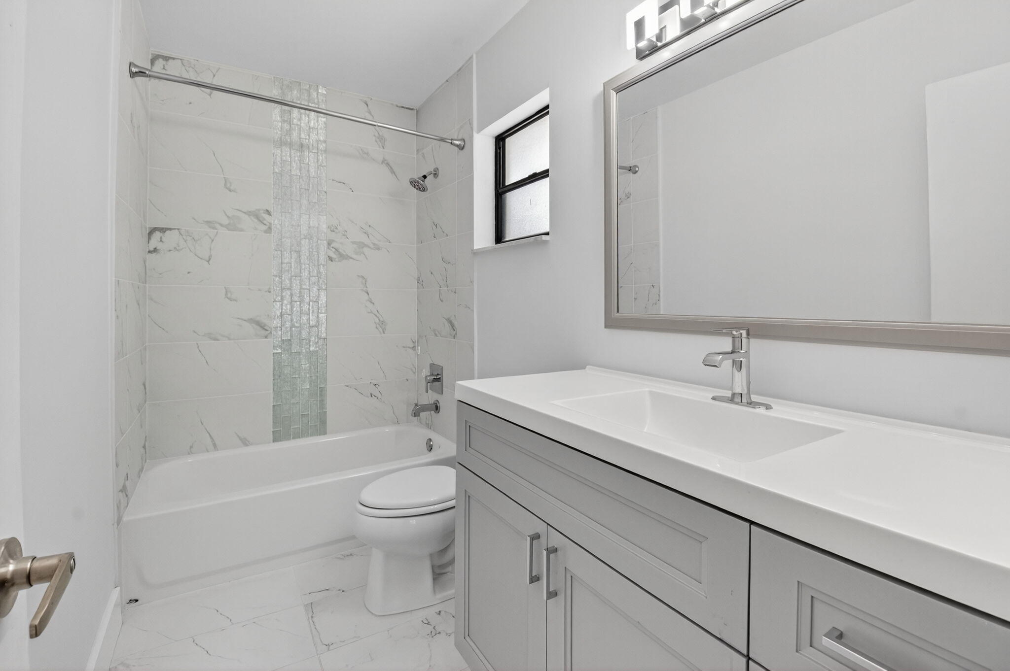 4135 Bay Laurel Way Boca Raton, FL 33487 - Photo 32 of 52 a bathroom with a sink a toilet and a large mirror