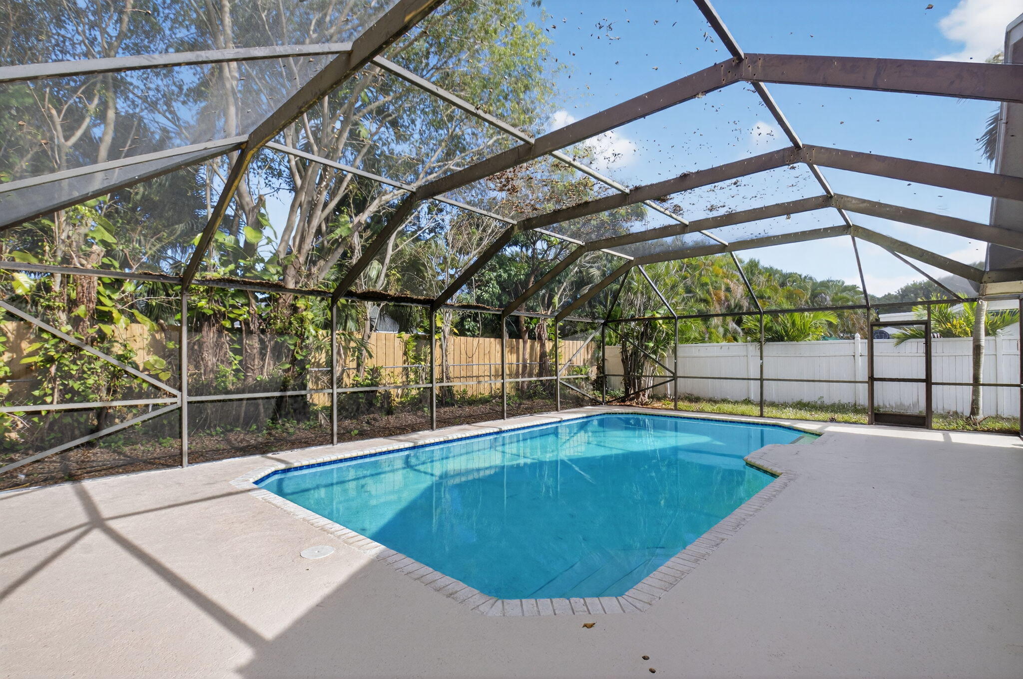 4135 Bay Laurel Way Boca Raton, FL 33487 - Photo 38 of 52 a view of a swimming pool with a patio and a yard