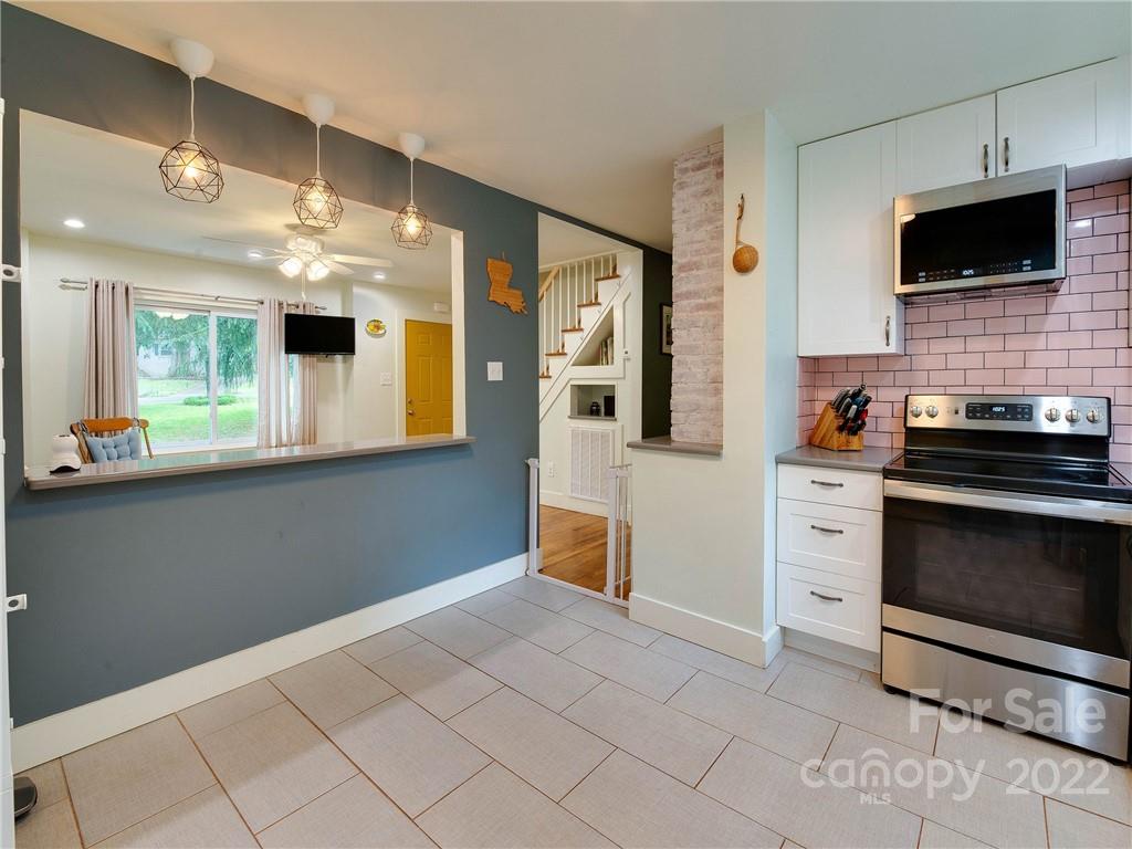 3501 Mathis Drive Charlotte, NC 28208 - Photo 12 of 42 a kitchen with stainless steel appliances a stove microwave and sink