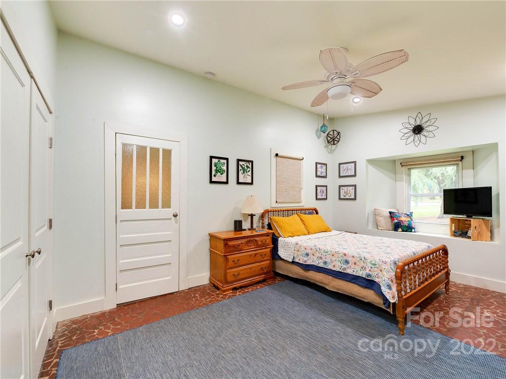 3501 Mathis Drive Charlotte, NC 28208 - Photo 17 of 42 a bedroom with a bed and ceiling fan
