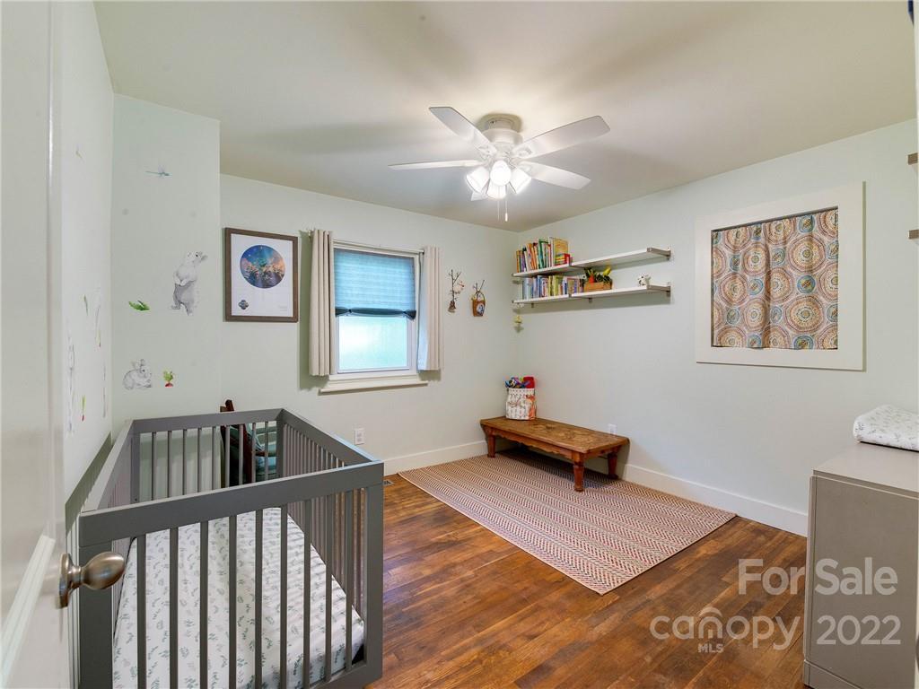 3501 Mathis Drive Charlotte, NC 28208 - Photo 19 of 42 a living room with furniture and paintings on the wall