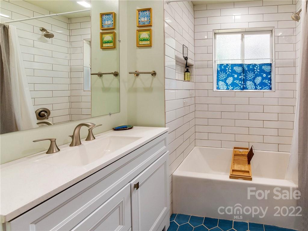 3501 Mathis Drive Charlotte, NC 28208 - Photo 21 of 42 a bathroom with a sink and a bathtub