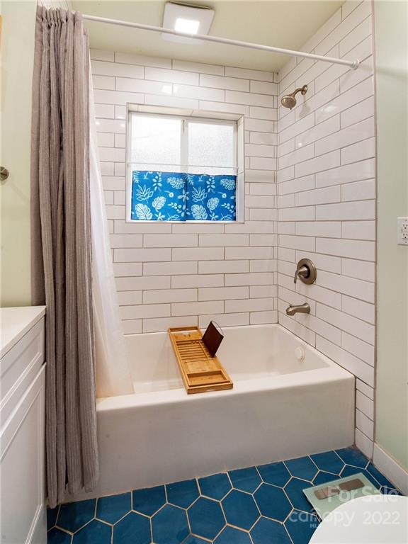 3501 Mathis Drive Charlotte, NC 28208 - Photo 23 of 42 a bathroom with a tub and a window