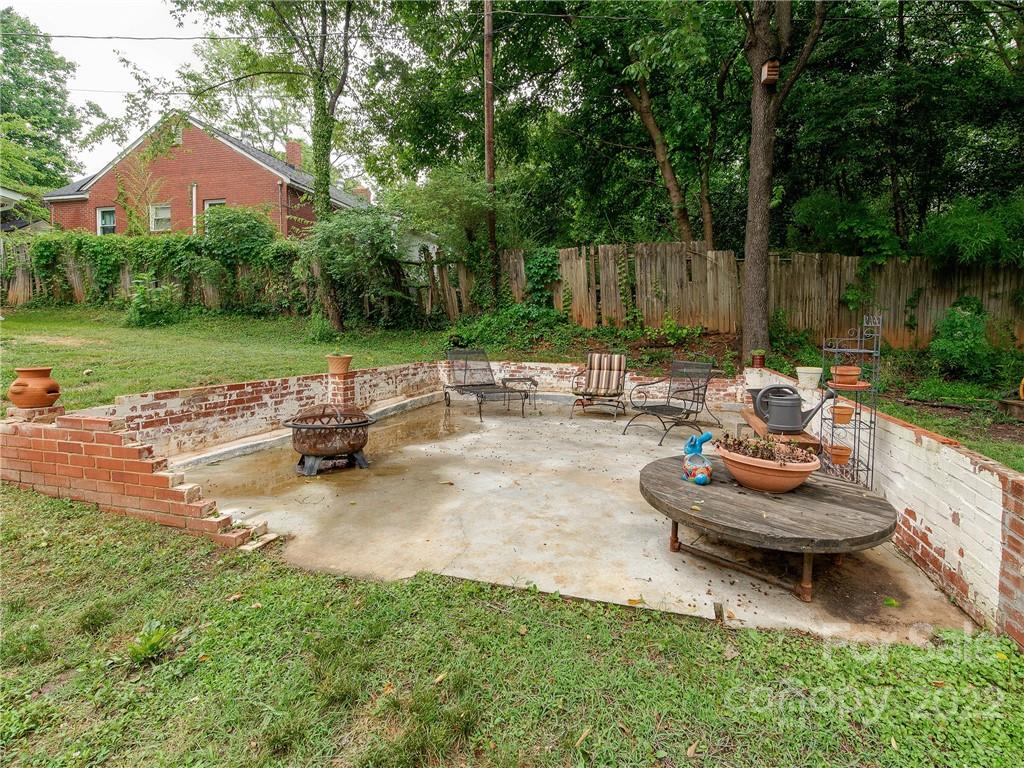 3501 Mathis Drive Charlotte, NC 28208 - Photo 32 of 42 a backyard of a house with yard and outdoor seating