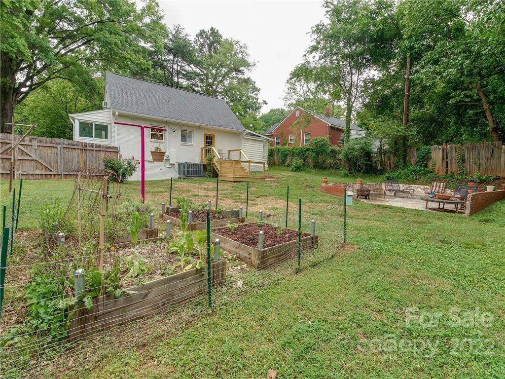 3501 Mathis Drive Charlotte, NC 28208 - Photo 35 of 42 a view of a house with backyard and a slide