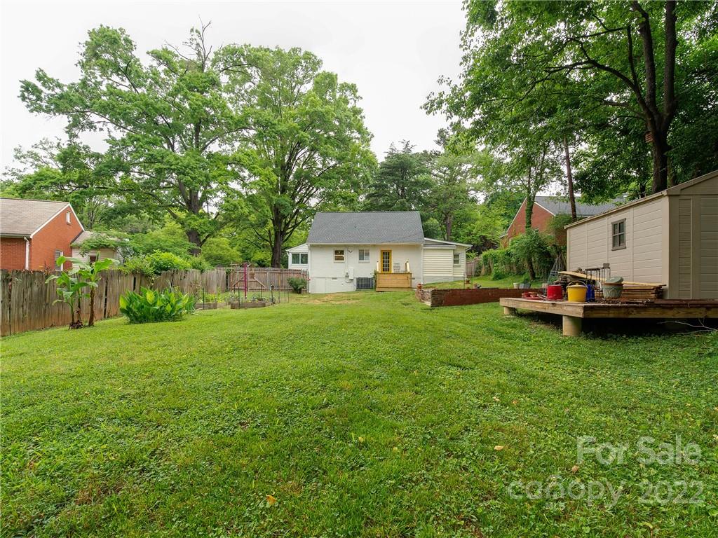 3501 Mathis Drive Charlotte, NC 28208 - Photo 37 of 42 a view of a white house in front of a big yard with large trees