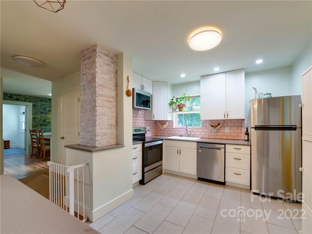 3501 Mathis Drive Charlotte, NC 28208 - Photo 8 of 42 a kitchen with a sink stainless steel appliances and cabinets