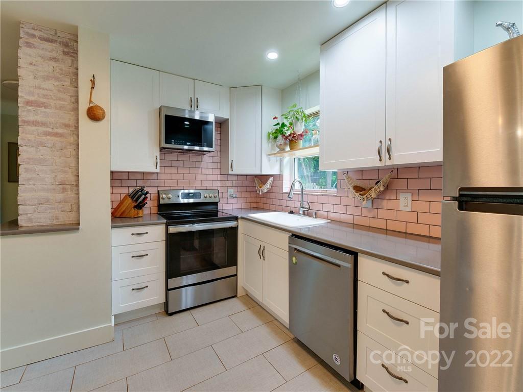 3501 Mathis Drive Charlotte, NC 28208 - Photo 9 of 42 a kitchen with stainless steel appliances white cabinets and a sink