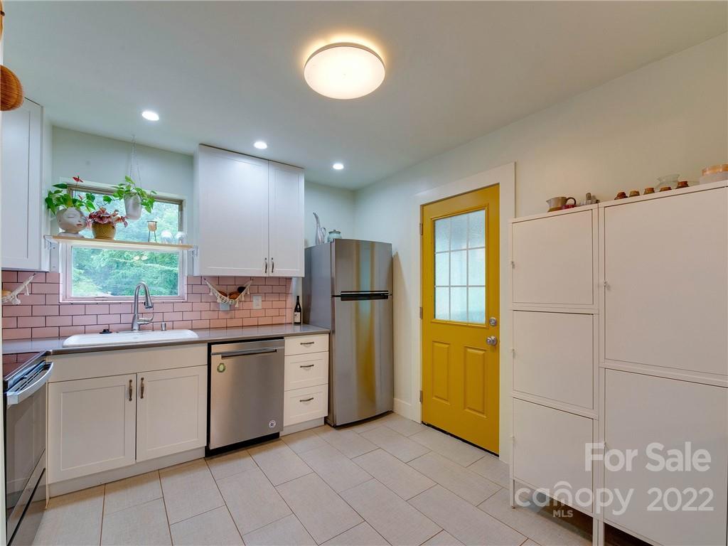 3501 Mathis Drive Charlotte, NC 28208 - Photo 10 of 42 a kitchen with stainless steel appliances granite countertop a refrigerator and a sink