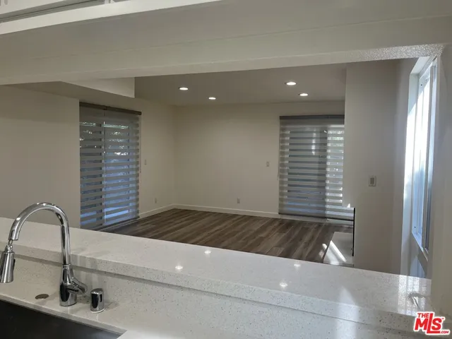 a view of a hallway with washer and dryer