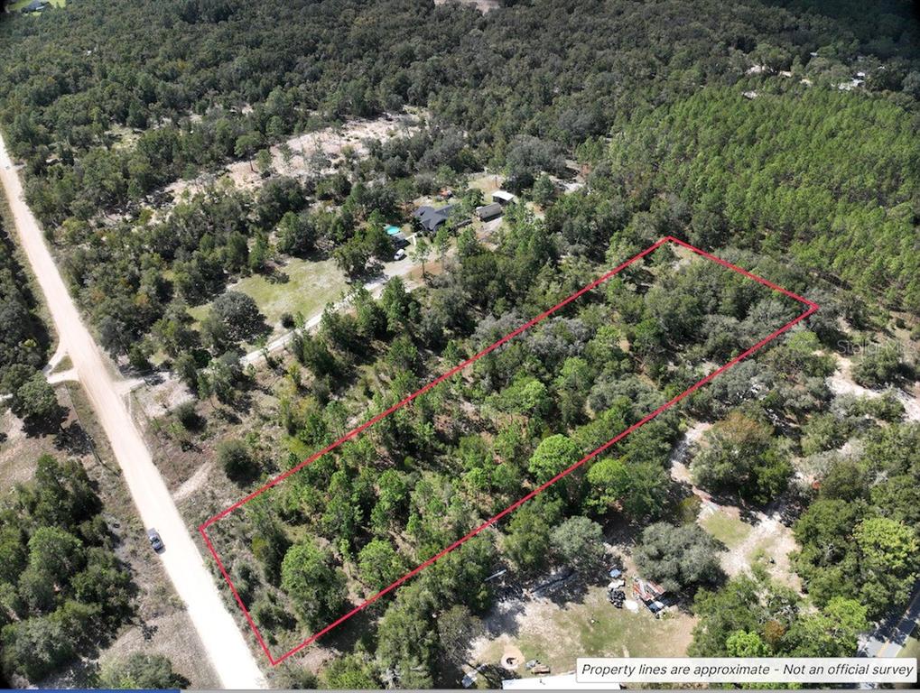 Northeast 90th Avenue Bronson, FL 32621 - Photo 5 of 6 an aerial view of a houses with a yard