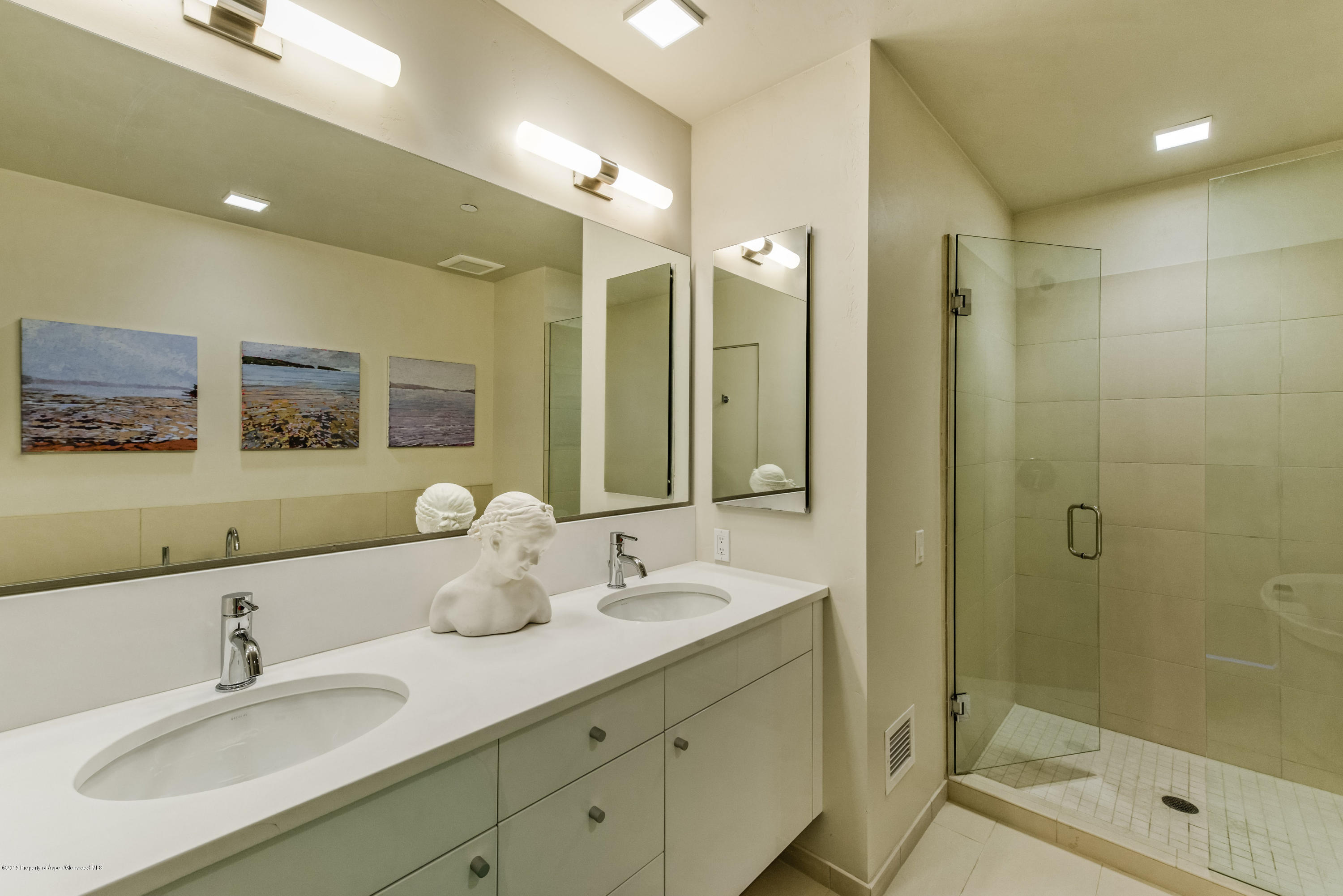 200 Evans Road, Unit 103 Basalt, CO 81621 - Photo 8 of 26 a bathroom with a double vanity sink mirror and shower