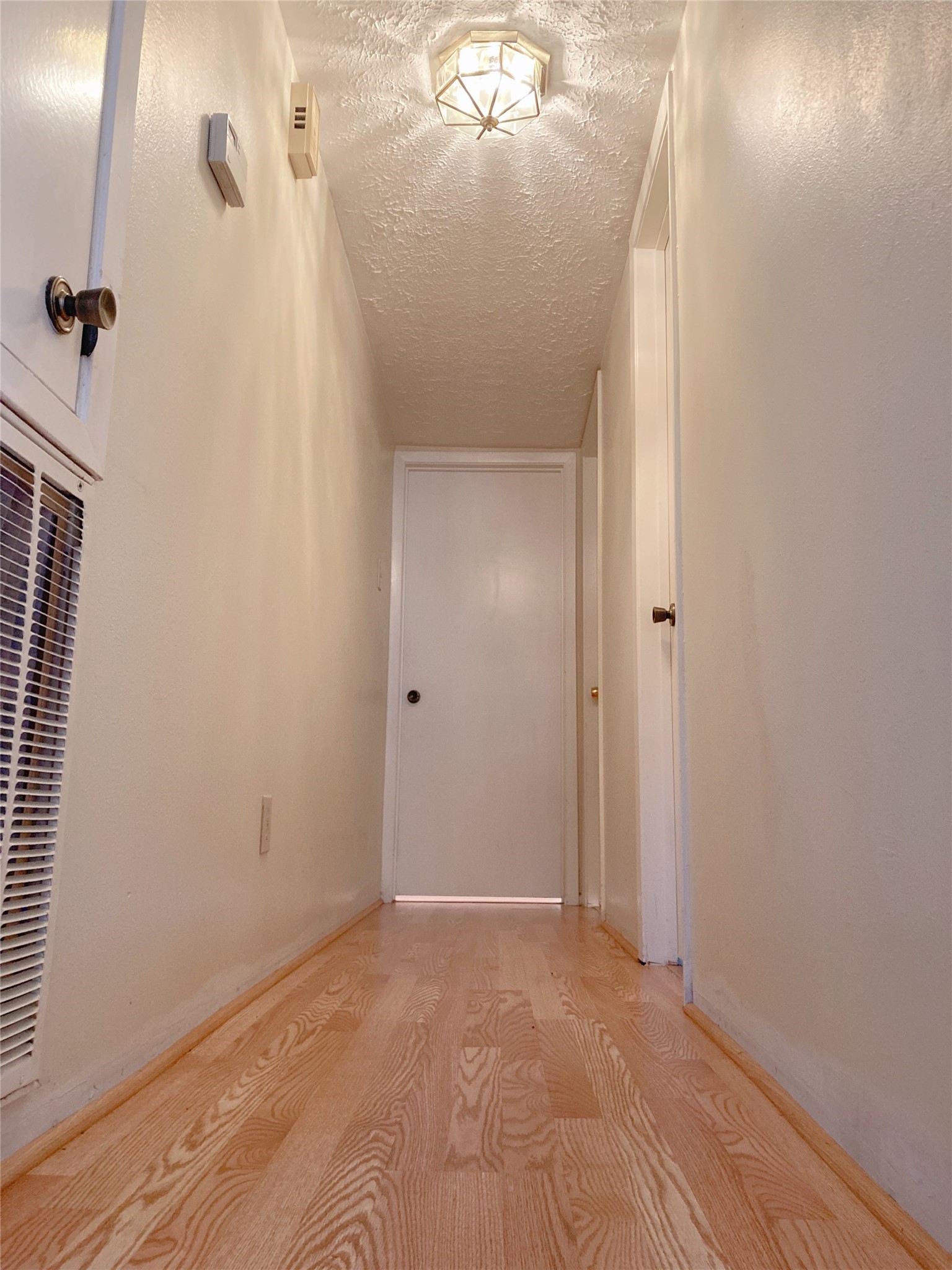 19518 Munsey Court Katy, TX 77449 - Photo 15 of 45 an empty room with wooden floor and mirror