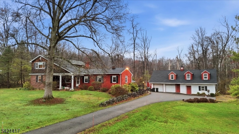 a view of house with a yard