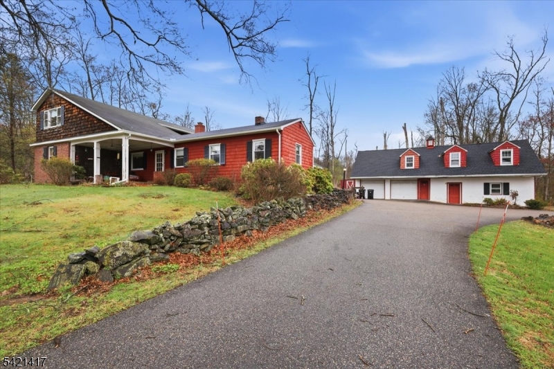 100 Old Croton Road Flemington, NJ 08822 - Photo 2 of 39 a front view of a house with a yard and lake view