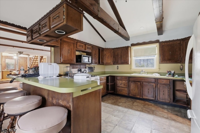 100 Old Croton Road Flemington, NJ 08822 - Photo 5 of 39 a large kitchen with stainless steel appliances kitchen island granite countertop a sink a stove a dining table and chairs