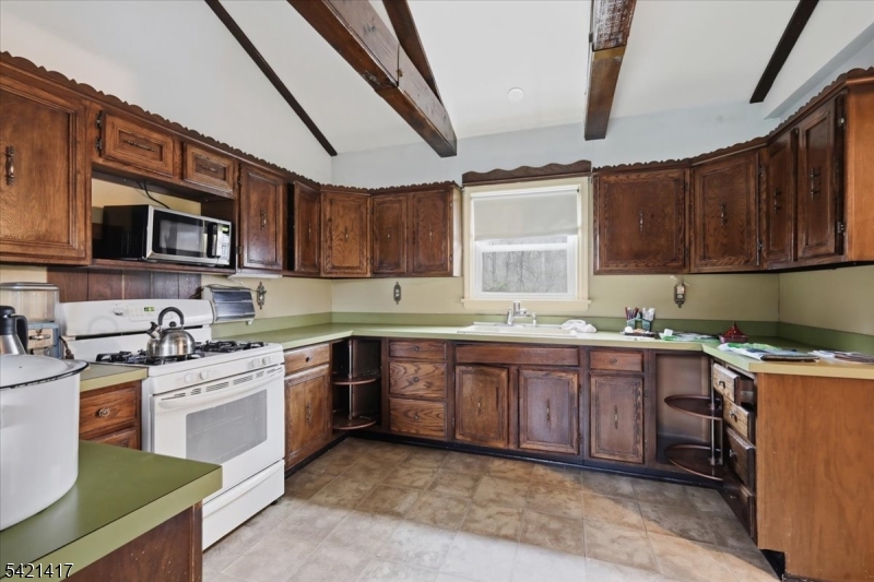 100 Old Croton Road Flemington, NJ 08822 - Photo 6 of 39 a kitchen with stainless steel appliances granite countertop wooden cabinets sink stove and microwave