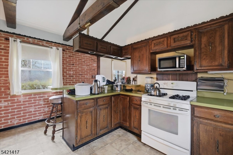 100 Old Croton Road Flemington, NJ 08822 - Photo 7 of 39 a kitchen with a stove a sink and a microwave