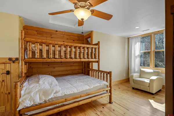 a bedroom with furniture and a window