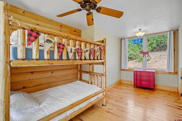 a bedroom with furniture and a window