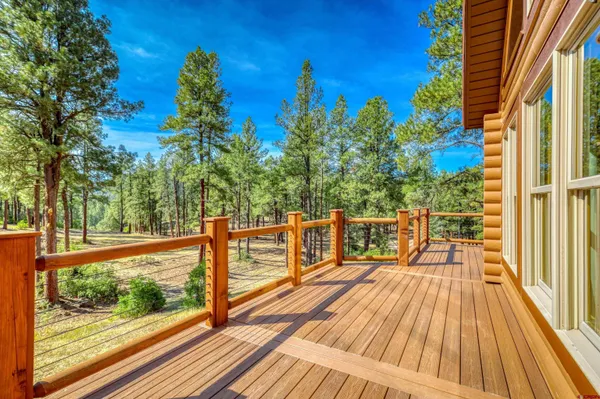 a view of balcony with wooden floor and outdoor space