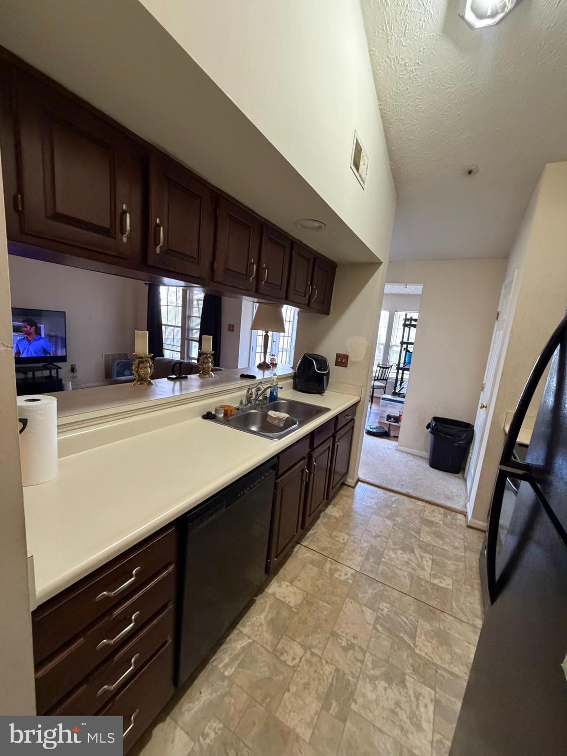 1305 Clover Valley Way, Unit 1305 Edgewood, MD 21040 - Photo 11 of 44 a kitchen with stainless steel appliances a sink stove and cabinets