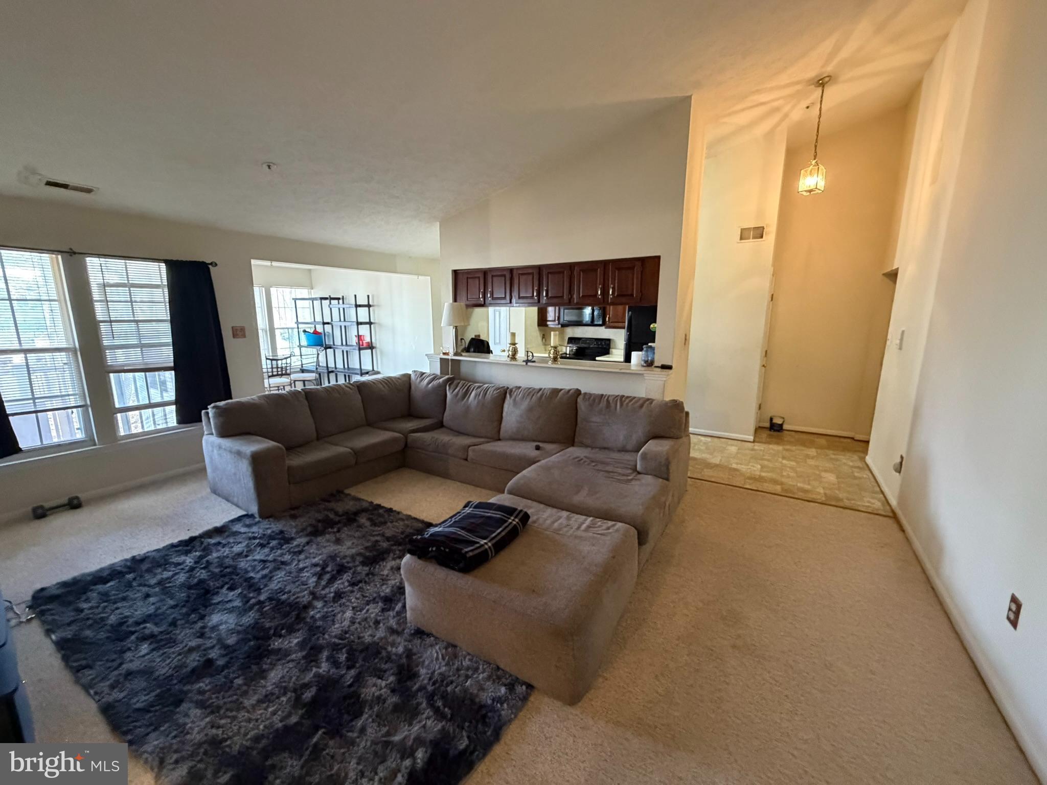 1305 Clover Valley Way, Unit 1305 Edgewood, MD 21040 - Photo 13 of 44 a living room with a couch and a window