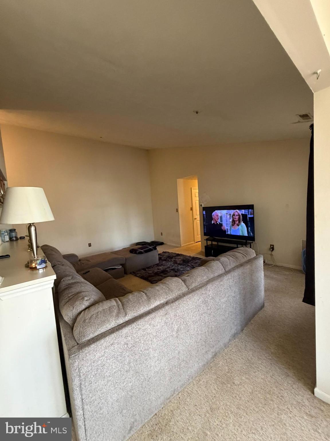 1305 Clover Valley Way, Unit 1305 Edgewood, MD 21040 - Photo 15 of 44 a living room with furniture and a flat screen tv