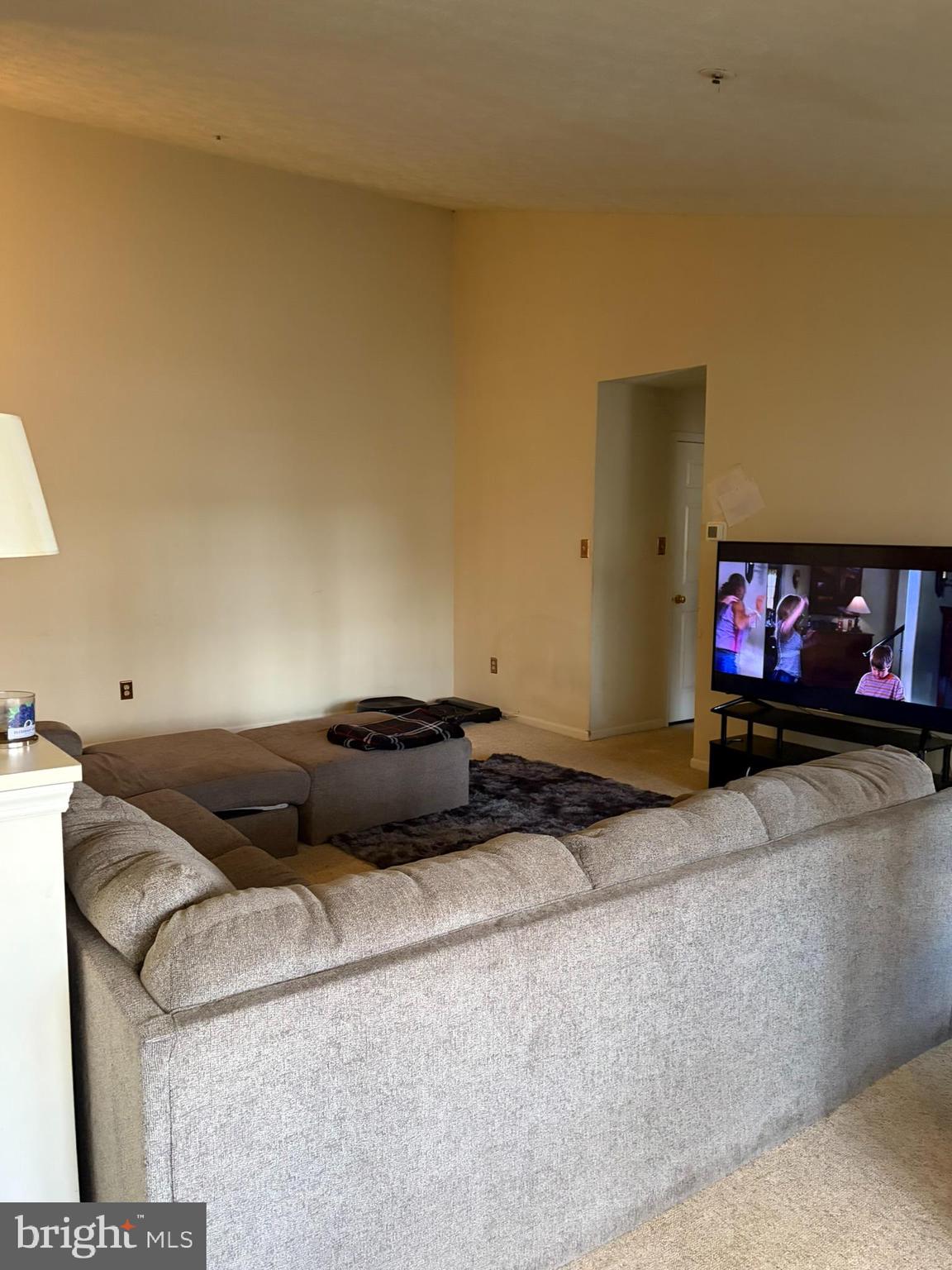 1305 Clover Valley Way, Unit 1305 Edgewood, MD 21040 - Photo 16 of 44 a living room with furniture and a flat screen tv
