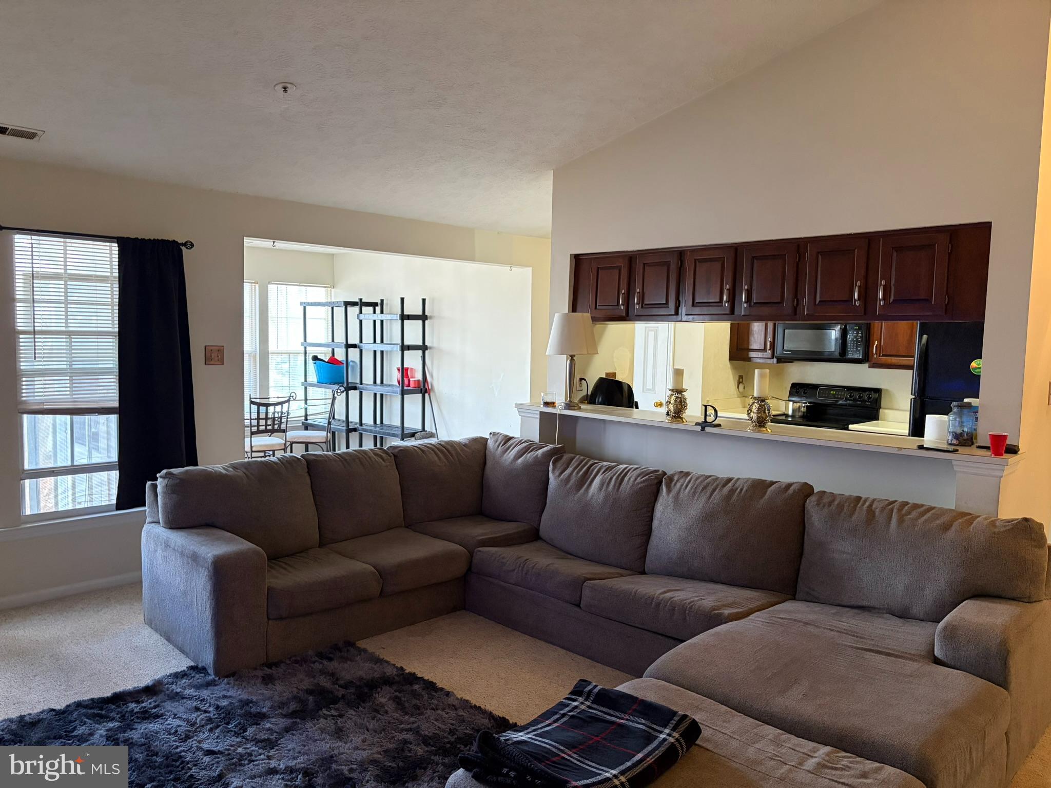 1305 Clover Valley Way, Unit 1305 Edgewood, MD 21040 - Photo 19 of 44 a living room with a couch and a window
